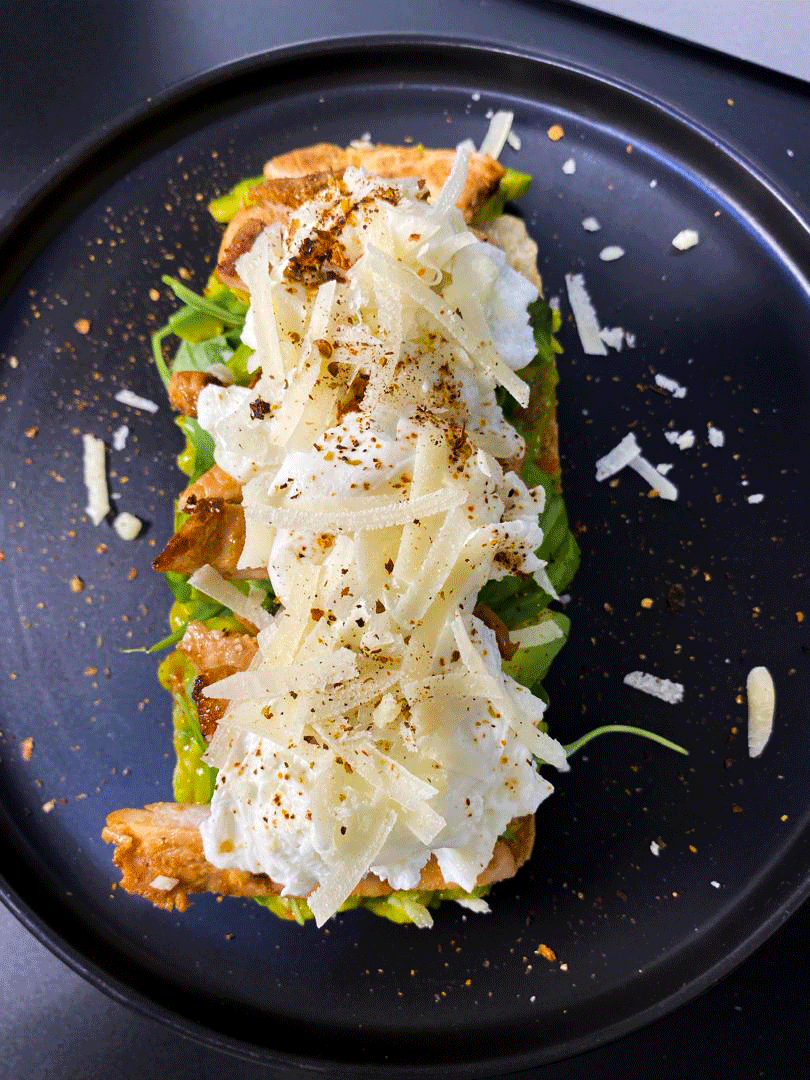 Deconstructed avocado chicken sandwich presentation